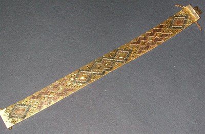 Lot 97 - Flexible Gold Bracelet 18 kt. yellow, white...