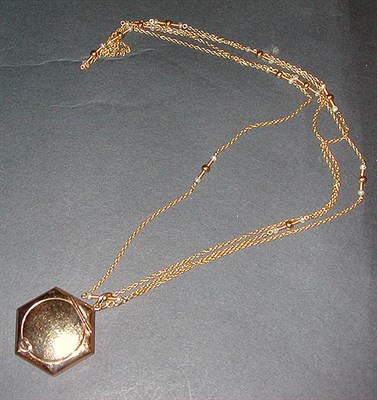 Lot 100 - Gold Chain and Locket The14 kt. yellow gold...
