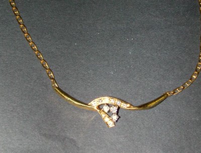 Lot 160 - Diamond Cluster Pendant and Chain The 14 kt....