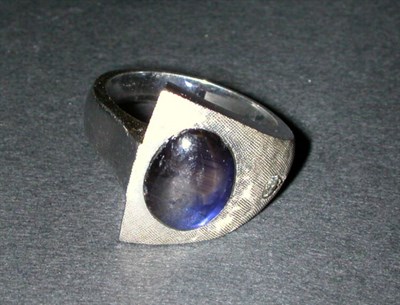 Lot 163 - Black Star Sapphire and Diamond Ring The 14 kt....