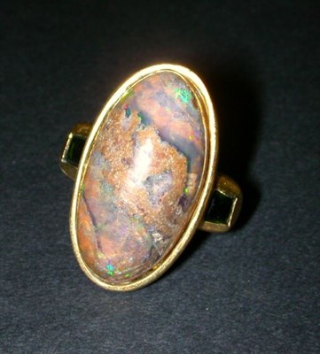 Lot 181 - Boulder Opal and Tourmaline Ring The 18 kt....
