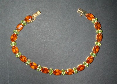 Lot 106 - Citrine and Peridot Bracelet 14 kt. yellow...