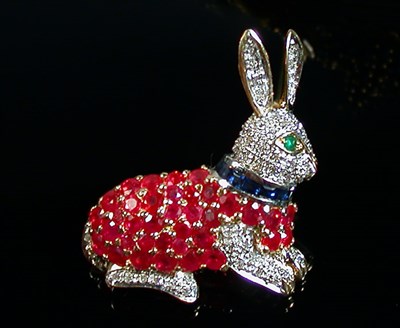Lot 131 - Ruby, Diamond and Sapphire Rabbit Pin 18 kt....