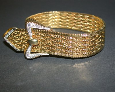 Lot 395 - Wide Gold Flexible Bracelet The 18 kt. yellow...