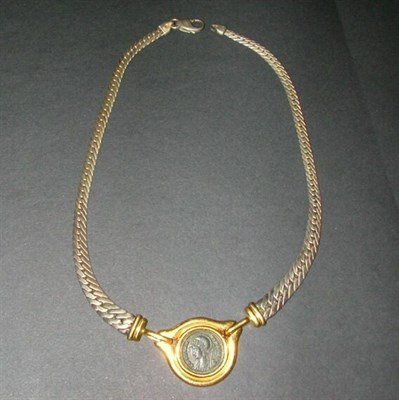 Lot 141 - Coin Pendant and Silver Chain The yellow gold...