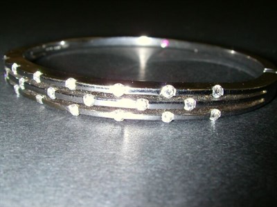 Lot 166 - White Gold and Diamond Bangle Bracelet 18 kt....