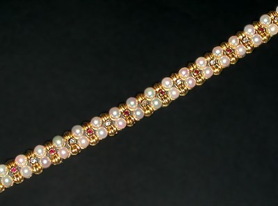 Lot 274 - Cultured Pearl, Diamond and Ruby Bracelet 18...