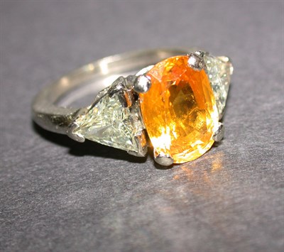 Lot 404 - Yellow Sapphire and Diamond Ring The 14 kt....
