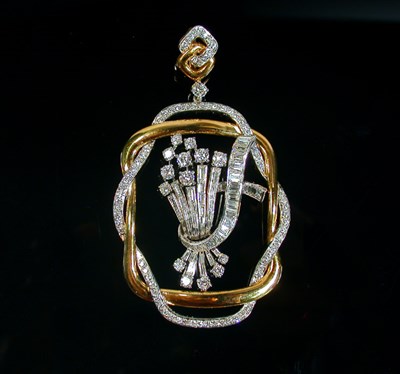 Lot 352 - Platinum, Gold and Diamond Pendant 18 kt....