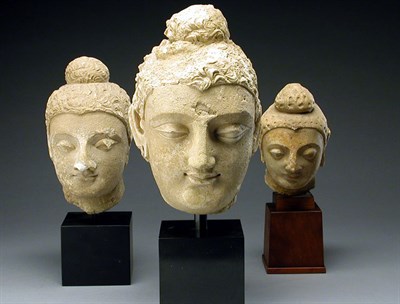 Lot 381 - Three Gandharan Stucco Heads of Buddha Circa...