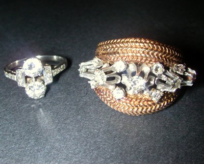 Lot 92 - Two Gold and Diamond Rings 14 kt. white and...