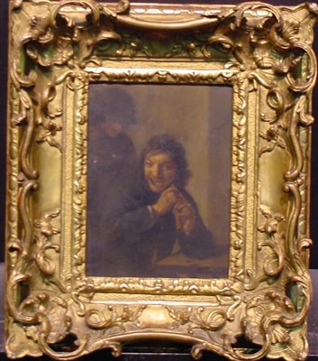 Lot 128 - Attributed to Adriaen Brouwer MAN PLAYING A...