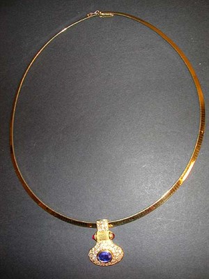 Lot 323 - Gold Necklace and Enhancer The 18 kt. yellow...