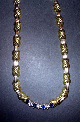 Lot 320 - Gold, Diamond and Sapphire Necklace The 18 kt....