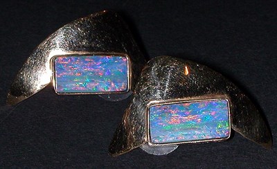 Lot 55 - Pair of Gold and Opal Earrings 14 kt. yellow...