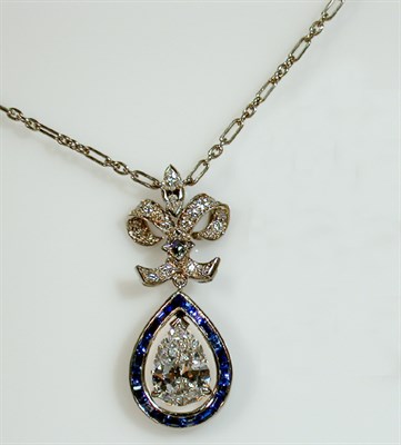 Lot 412 - Diamond and Sapphire Pendant Necklace...