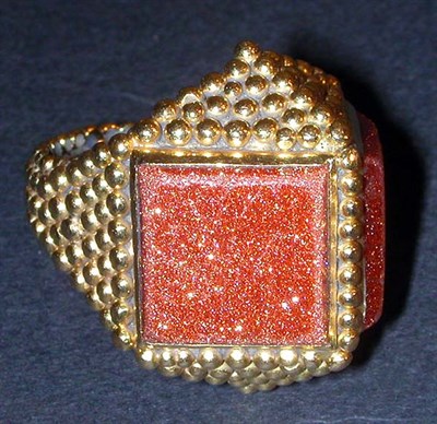 Lot 314 - Gold Pyramid Ring The 18 kt. yellow gold bead...