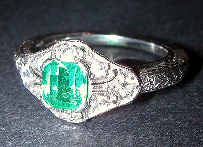 Lot 117 - Emerald and Diamond Ring The 14 kt. white gold...