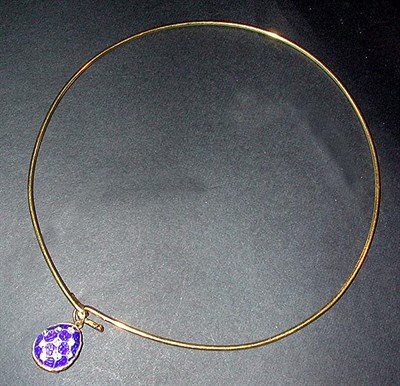 Lot 22 - Gold Torque and Pendant The 18 kt. yellow gold...
