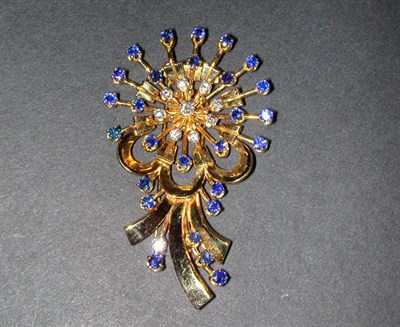 Lot 134 - Diamond and Sapphire Flower Pin 14 kt. yellow...