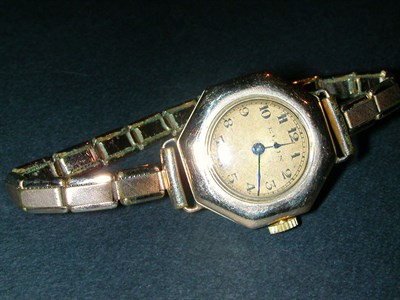 Lot 1 - Lady's Gold Wristwatch The metal band...