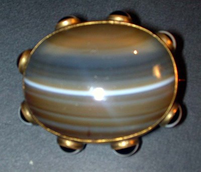 Lot 15 - Agate Pin The metal frame centering an oval...