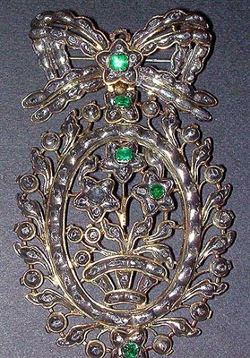 Lot 28 - Emerald Pin Silver, the openwork pin designed...