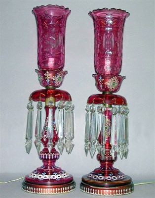 Lot 575 - Pair of Bohemian Enameled Cranberry Cut Glass...