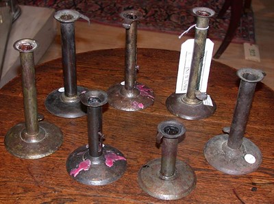 Lot 103 - Group of Seven Metal Hogscraper Candlesticks...