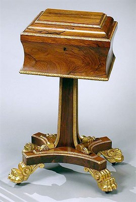Lot 559 - Regency Parcel Gilt and Rosewood Teapoy The...