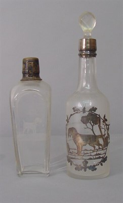 Lot 56 - Two Colorless and Silver Decanters Each...