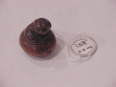 Lot 158 - Boxwood Netsuke of a Puppy on a Cushion Early...