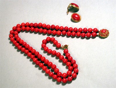 Lot 192 - Double Strand Coral Bead Necklace and Earrings...