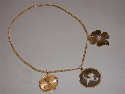 Lot 195 - Three Gold Charms and Chain 14 kt. yellow gold,...
