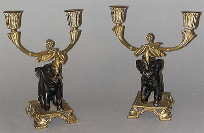 Lot 584 - Pair of Bronze Figural Candelabra Each cast as...