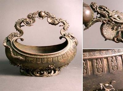 Lot 266 - Japanese Bronze Basket With dragon-form handle....