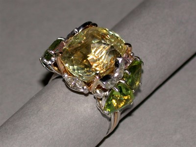Lot 193 - Yellow Sapphire, Peridot and Diamond Cluster...