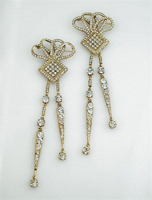 Lot 727 - Pair of Dramatic Bow Motif Pendants Set with...