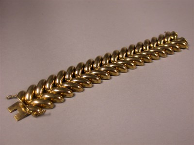 Lot 286 - Wide Gold Bracelet The 14 kt. yellow gold...