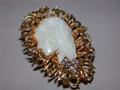 Lot 309 - Carved Opal and Diamond Pin The 18 kt. yellow...