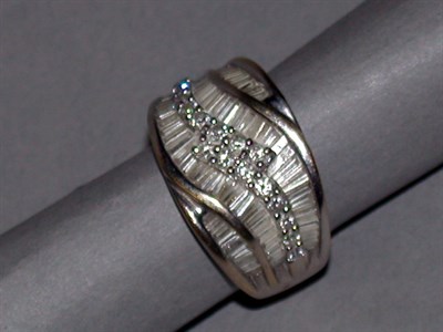 Lot 181 - Diamond Band 18 kt. white gold, of swirl...