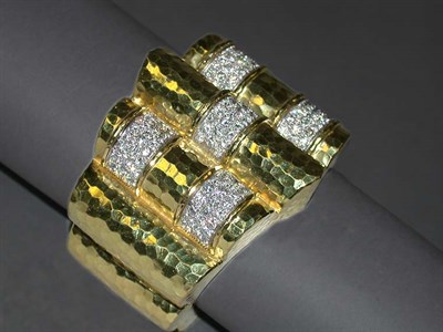 Lot 214 - Gold and Diamond Bangle Bracelet