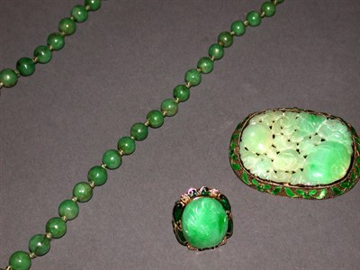 Lot 202 - Group of assorted jade jewelry, comprising a...