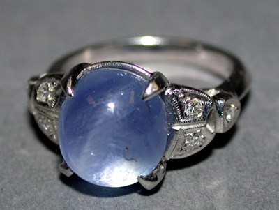 Lot 361 - Star Sapphire and Diamond Ring 14 kt. white...
