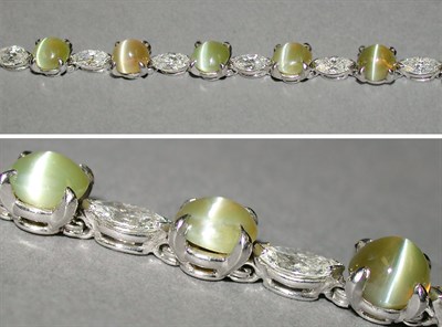 Lot 364 - Cat's-Eye Chrysoberyl and Diamond Line...