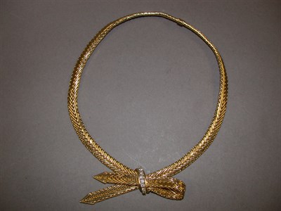 Lot 352 - Gold and Diamond Bow Necklace 18 kt. yellow...