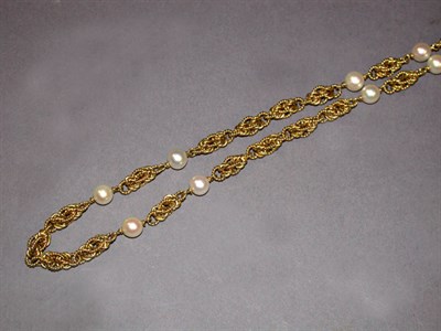 Lot 354 - Gold and Cultured Pearl Long Chain The 18 kt....