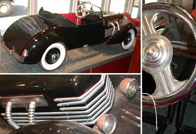 Lot 270A - Black Painted Pedal Car Length 57 inches.