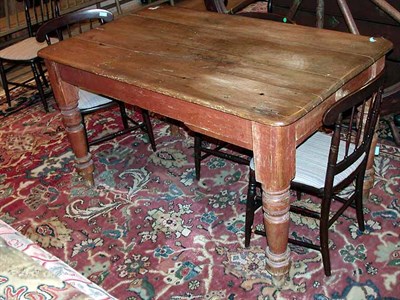 Lot 104 - Stained Pine Farm Table The rectangular top...