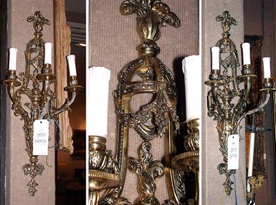 Lot 638 - Pair of Louis XVI Style Bronze Three-Light...